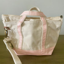 Load image into Gallery viewer, Crossbody Ivory Tote w/ Pink Accent handles and Coquette style Initial Bag Tag with charm